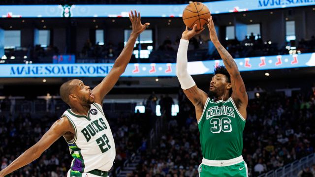 Boston Celtics guard Marcus Smart, Milwaukee Bucks forward Khris Middleton