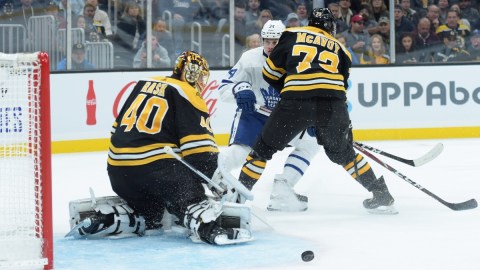 Boston Bruins goaltender Tuukka Rask (40), defenseman Charlie McAvoy (73) and Toronto Maple Leafs center Auston Matthews (34)