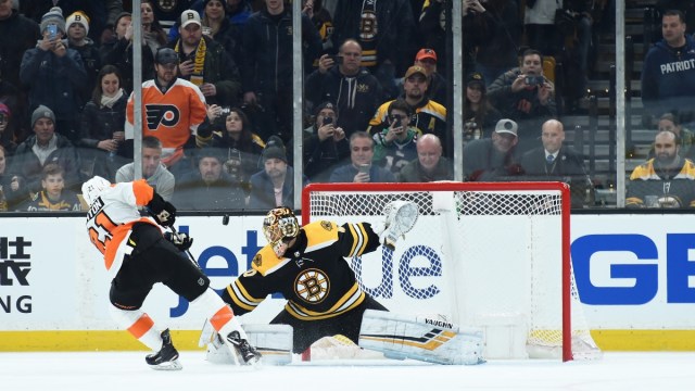 Boston Bruins goaltender Tuukka Rask (40) and Philadelphia Flyers center Scott Laughton (21)