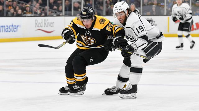 Boston Bruins left wing Brad Marchand and Los Angeles Kings left wing Alex Iafallo