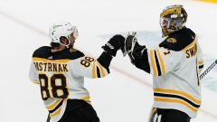 Boston Bruins forward David Pastrnak and goalie Jeremy Swayman