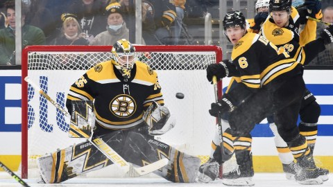 Boston Bruins goaltender Linus Ullmark (35) and defenseman Mike Reilly (6)