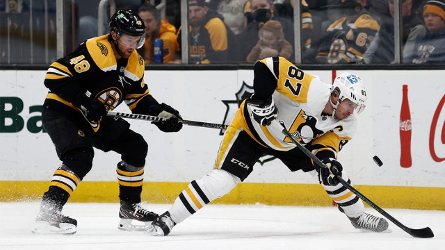 Pittsburgh Penguins center Sidney Crosby and Boston Bruins defenseman Matt Grzelcyk