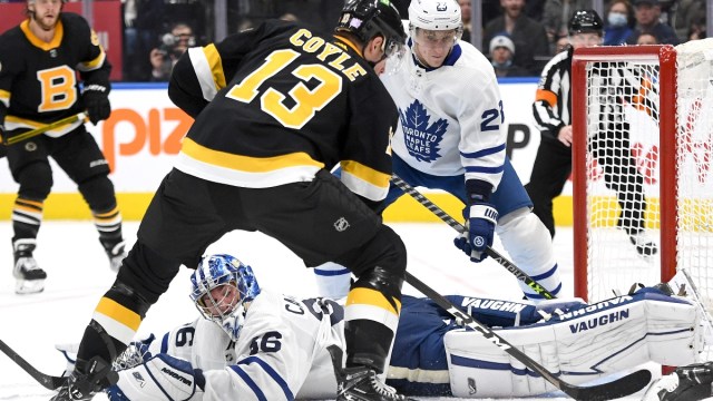 Toronto Maple Leafs goalie Jack Campbell (36) and Boston Bruins forward Charlie Coyle (13)