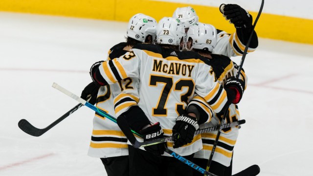 Boston Bruins defenseman Charlie McAvoy and teammates