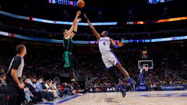 Boston Celtics forward Jayson Tatum (0) and Detroit Pistons forward Jerami Grant (9)