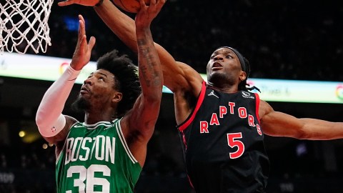 Boston Celtics guard Marcus Smart and Toronto Raptors forward Precious Achiuwa