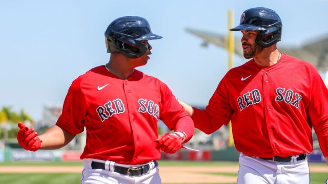 Boston Red Sox players Rafael Devers and J.D. Martinez