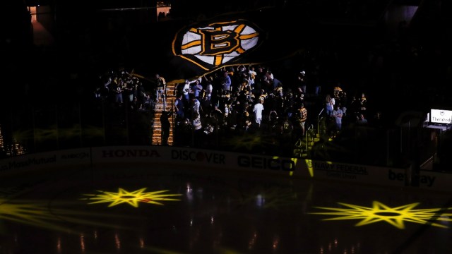 Fans pass around a Boston Bruins banner
