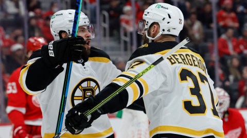 Boston Bruins center Patrice Bergeron (37) and right wing Craig Smith (12)