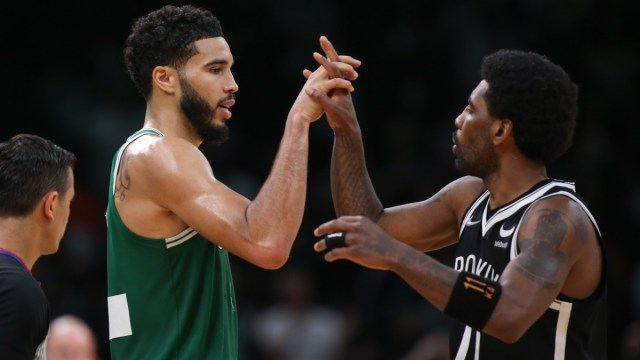 Brooklyn Nets guard Kyrie Irving (11) and Boston Celtics forward Jayson Tatum (0)