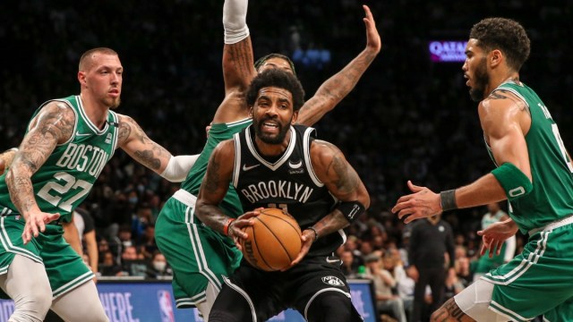Brooklyn Nets guard Kyrie Irving, Boston Celtics' Daniel Theis, Jayson Tatum