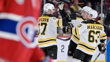 Boston Bruins forward Patrice Bergeron celebrates with teammates.