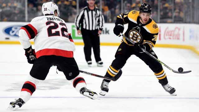 Boston Bruins left wing Taylor Hall (71) and Ottawa Senators defenseman Nikita Zaitsev (22)