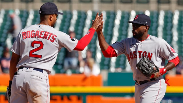 Boston Red Sox shortstop Xander Bogaerts (2) and center fielder Jackie Bradley Jr. (19) celebrate after defeating the Detroit Tigers