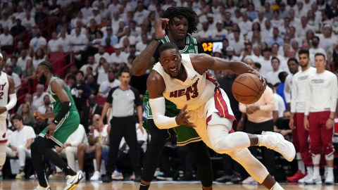 Miami Heat center Bam Adebayo drives past Boston Celtics forward Robert Williams