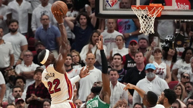 Miami Heat forward Jimmy Butler shoots over Boston Celtics guard Jaylen Brown