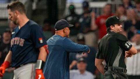 Boston Red Sox manager Alex Cora, home plate umpire Adam Beck, Red Sox catcher Kevin Plawecki