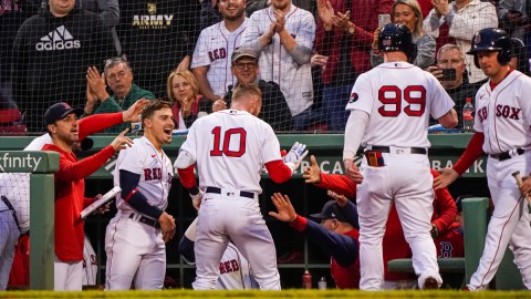 Boston Red Sox second baseman Trevor Story is congratulated by his teammates
