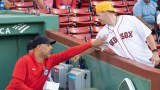 Boston Red Sox manager Alex Cora with former Red Sox player Brock Holt