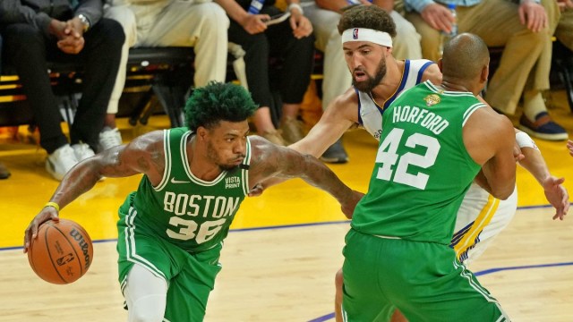 Boston Celtics guard Marcus Smart (36), center Al Horford (42), Golden State Warriors guard Klay Thompson (11)
