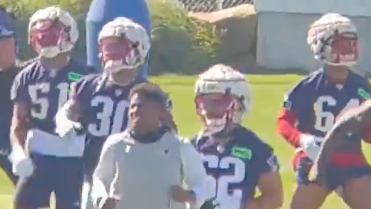 Here's why some Patriots players are wearing caps over their helmets during training  camp