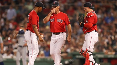 Boston Red Sox pitcher Brayan Bello, catcher Reese McGuire and pitching coach Dave Bush