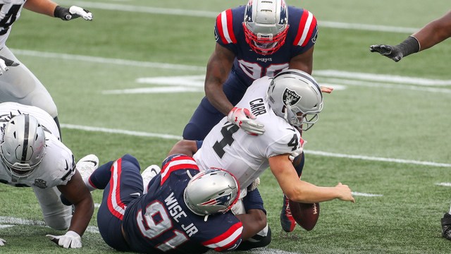 Las Vegas Raiders quarterback Derek Carr and New England Patriots defensive end Deatrich Wise