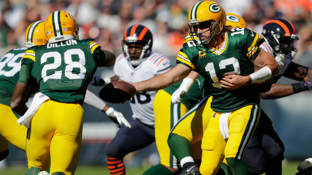 Green Bay Packers running back A.J. Dillon and quarterback Aaron Rodgers