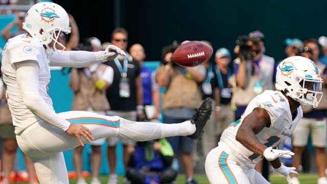 Miami Dolphins punter Thomas Morstead (4) wide receiver Trent Sherfield (14)
