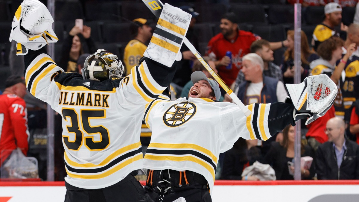Jeremy Swayman and Linus Ullmark of the Boston Bruins hug after the News  Photo - Getty Images