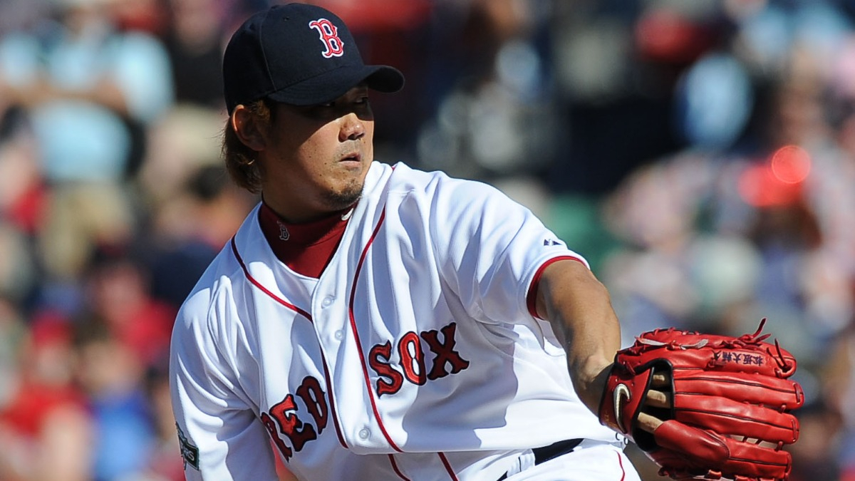 File photo taken in December 2006 shows Japanese pitcher Daisuke Matsuzaka  holding his jersey and cap during an introductory press conference with the Red  Sox in Boston. The two-time World Baseball Classic