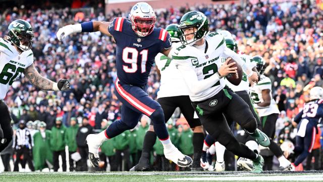 New England Patriots defensive end Deatrich Wise and New York Jets quarterback Zach Wilson