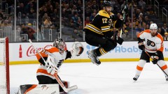 Boston Bruins left wing Nick Foligno, Philadelphia Flyers goaltender Carter Hart