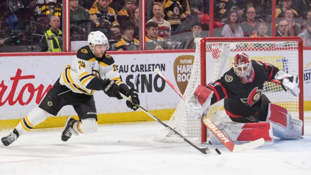 Boston Bruins forward Jake DeBrusk and Ottawa Senators goalie Cam Talbot
