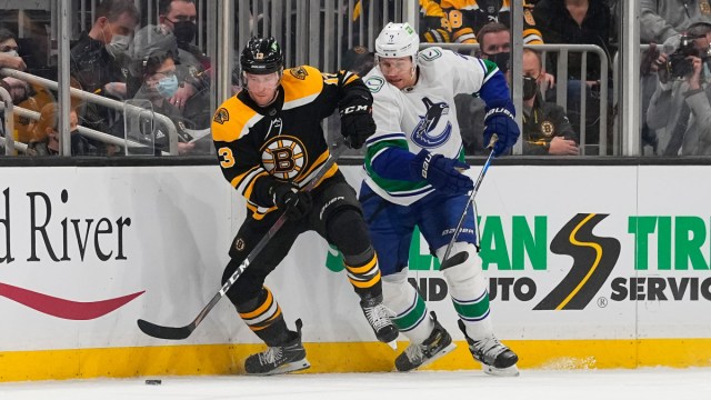 Boston Bruins forward Charlie Coyle and Vancouver Canucks defenseman Luke Schenn
