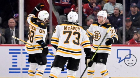 Boston Bruins forwards Taylor Hall and David Pastrnak and defenseman Charlie McAvoy