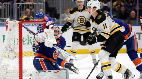 Boston Bruins forward Trent Frederic and New York islanders goalie Semyon Varlamov