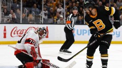 Boston Bruins right wing David Pastrnak, Ottawa Senators goaltender Kevin Mandolese