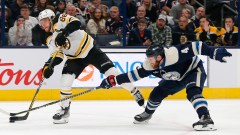 Boston Bruins winger David Pastrnak, Columbus Blue Jackets defenseman Vladislav Gavrikov