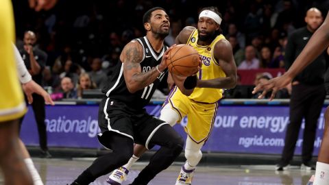 Dallas Mavericks guard Kyrie Irving and Los Angeles Lakers guard Patrick Beverley