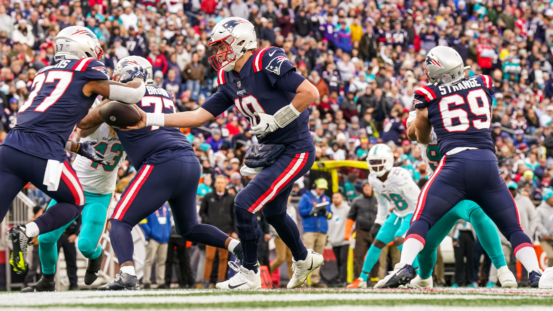 New England Patriots offensive lineman Cole Strange steps on the