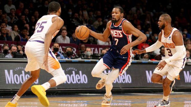 Brooklyn Nets guard Mikal Bridges and Phoenix Suns forward Kevin Durant and guard Chris Paul