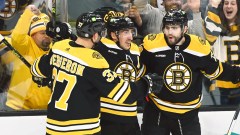 Boston Bruins forwards Patrice Bergeron, Brad Marchand and Jake DeBrusk