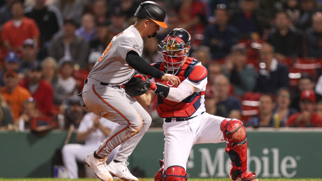 Boston Red Sox catcher Connor Wong tags out Baltimore Orioles infielder Ramon Urias
