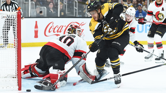 Boston Bruins forward David Pastrnak and Ottawa Senators goalie Mads Sogaard