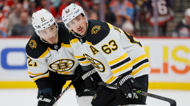 Boston Bruins forwards Brad Marchand and Garnet Hathaway