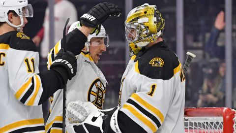 Boston Bruins left wing Brad Marchand and goalie Jeremy Swayman