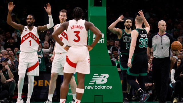 Boston Celtics forward Sam Hauser (30) drives against Miami Heat