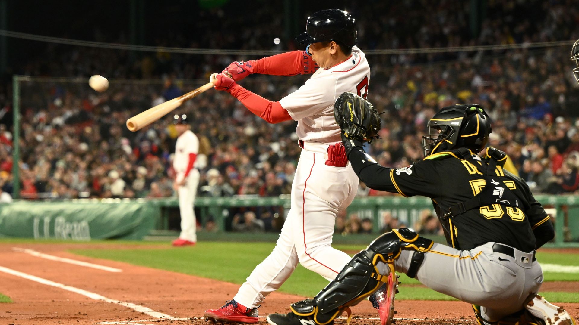 Masataka Yoshida of the Boston Red Sox celebrates in the dugout